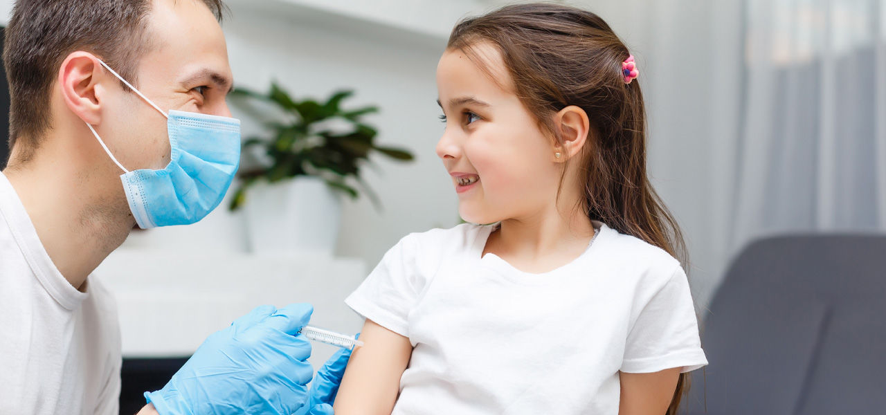 young girl at doctor's office for back to school physical