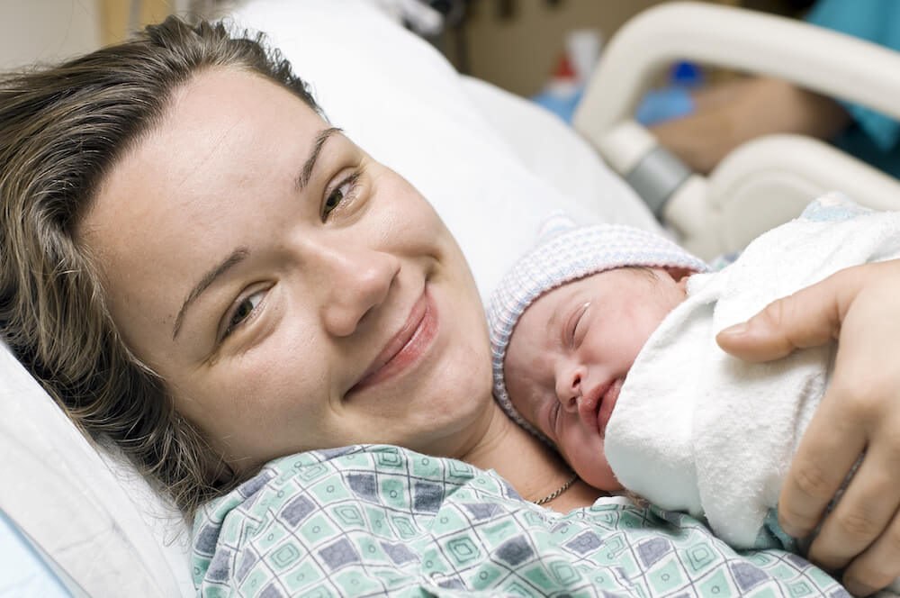 mom holding newborn baby